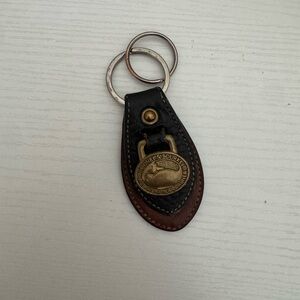 Dooney & Bourke Black and Brown Leather Key Holder with Brass Emblem